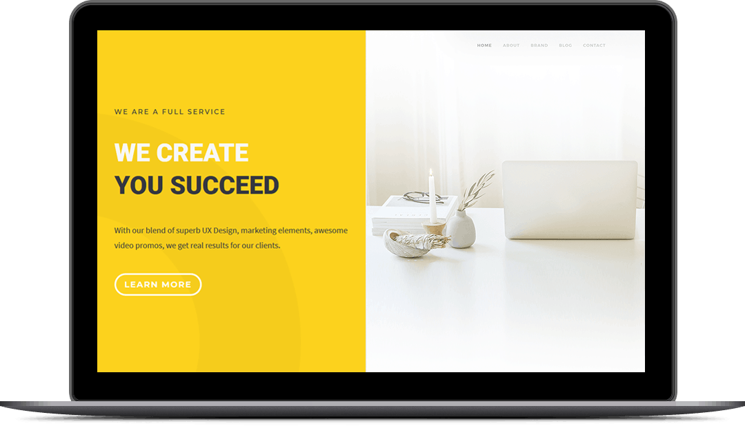 'We Create, You Succeed' demo website designed for a laptop